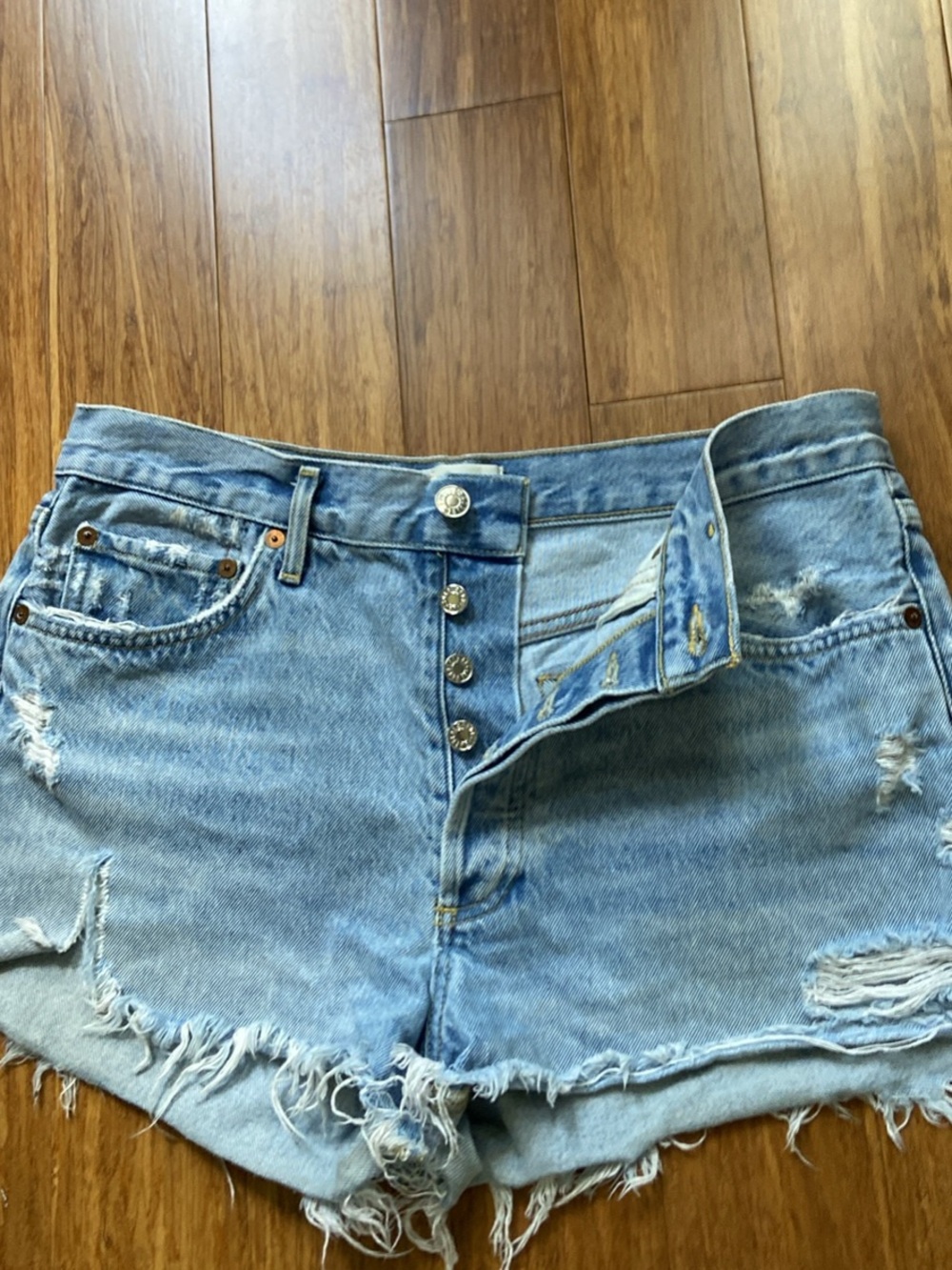 Agolde Light Blue Distressed Denim Cutoff Shorts